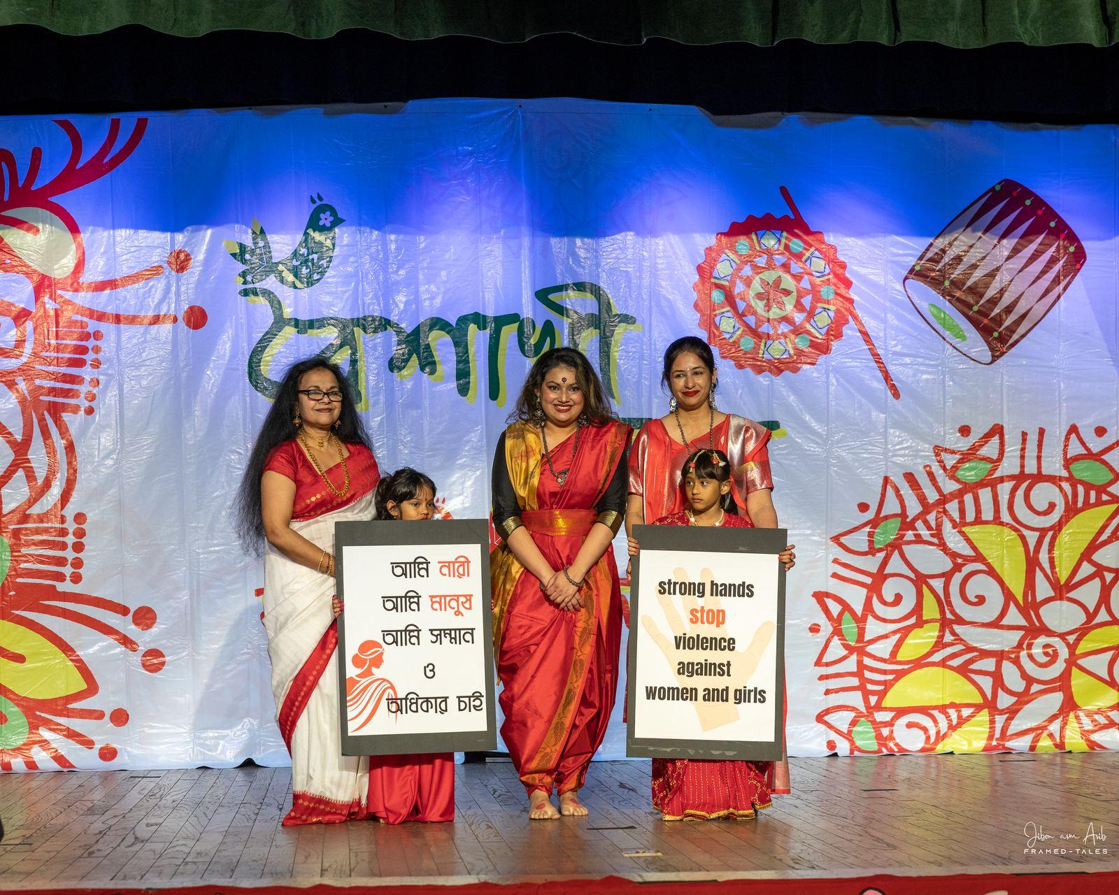 Women and girls with placards ("stop violence against women and girls")