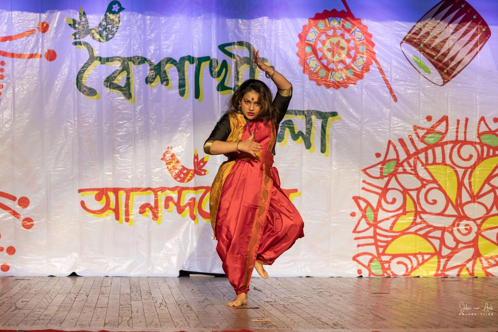 Same dancer, arms overhead