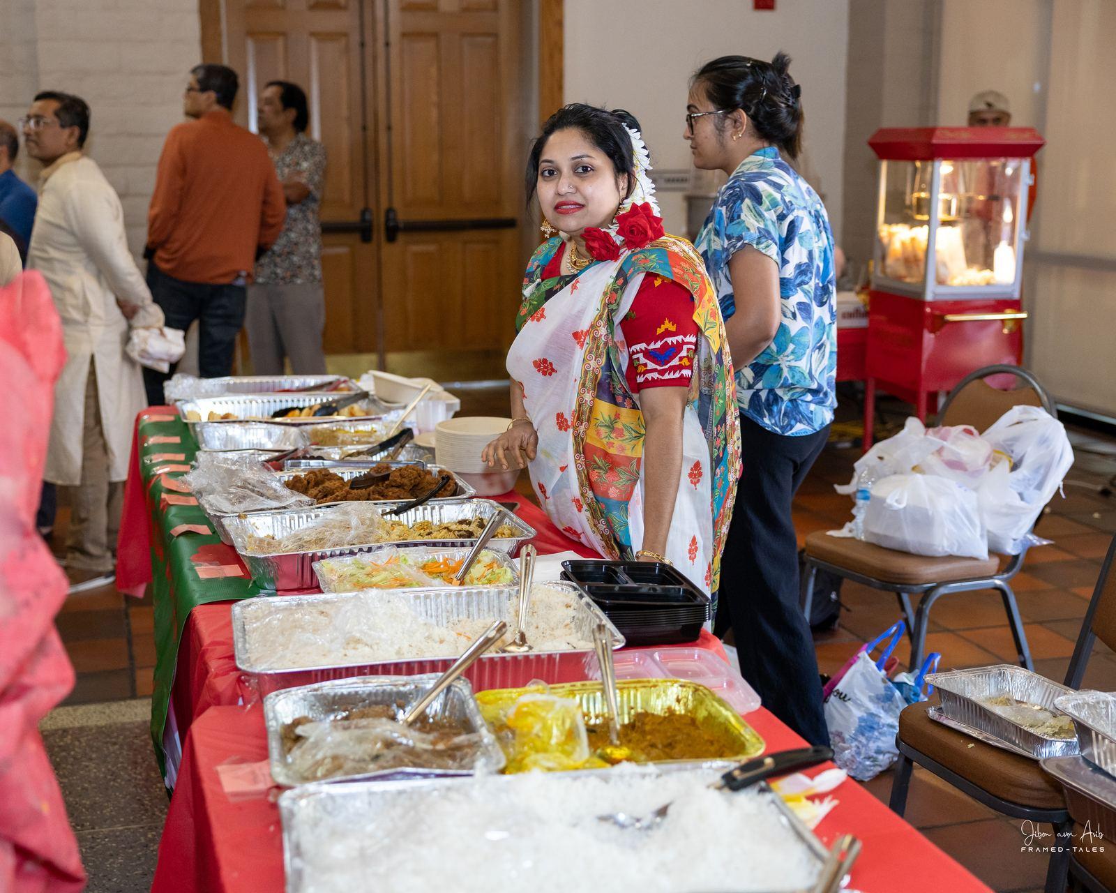 Buffet line with guest smiling at camera