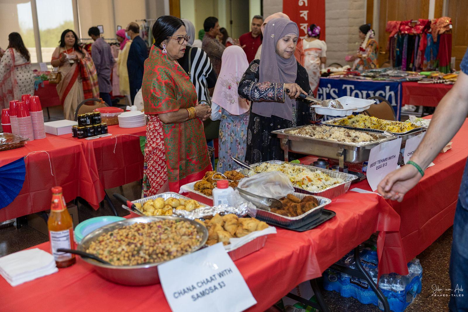 Chana chaat and samosa stall with labeled dishes